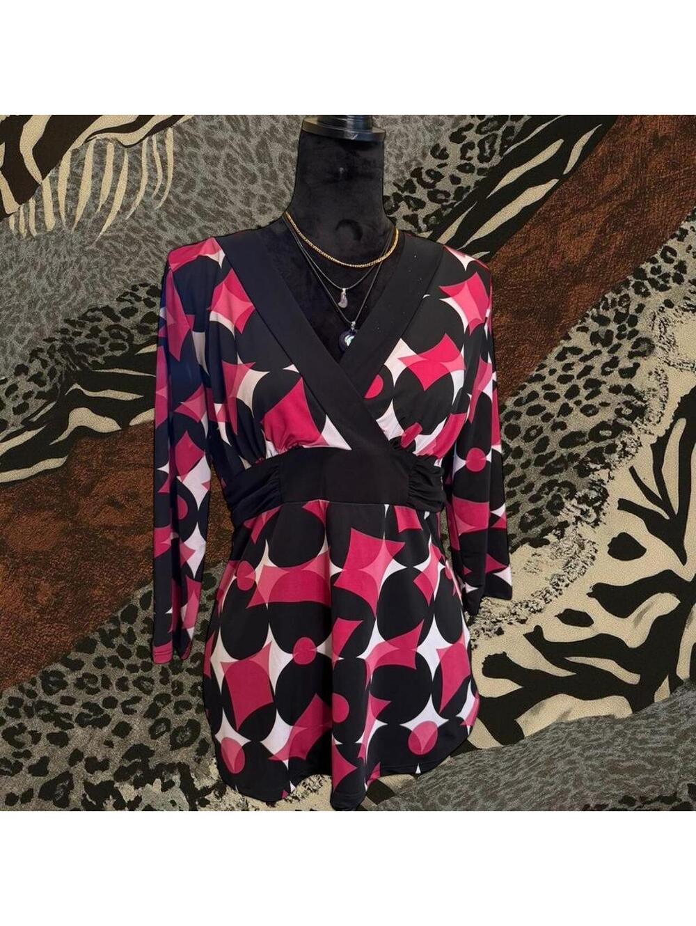 Maurices pink/black geometric print dress with tie waist and long sleeves.